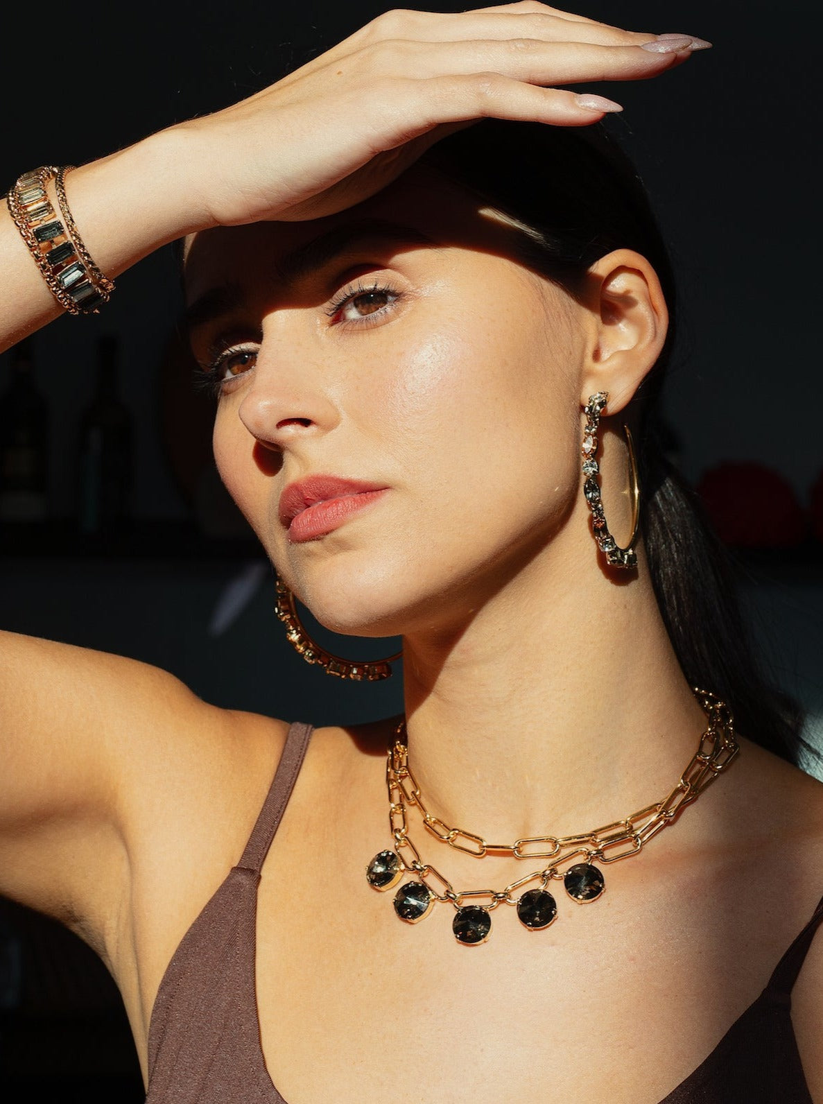 A photo of a woman  wearing a luna necklace