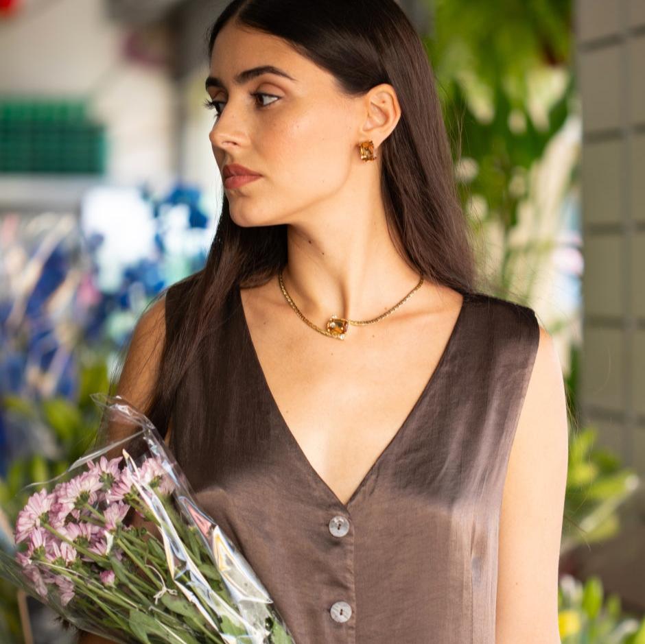 a photo of a woman wearing a Alba Necklace