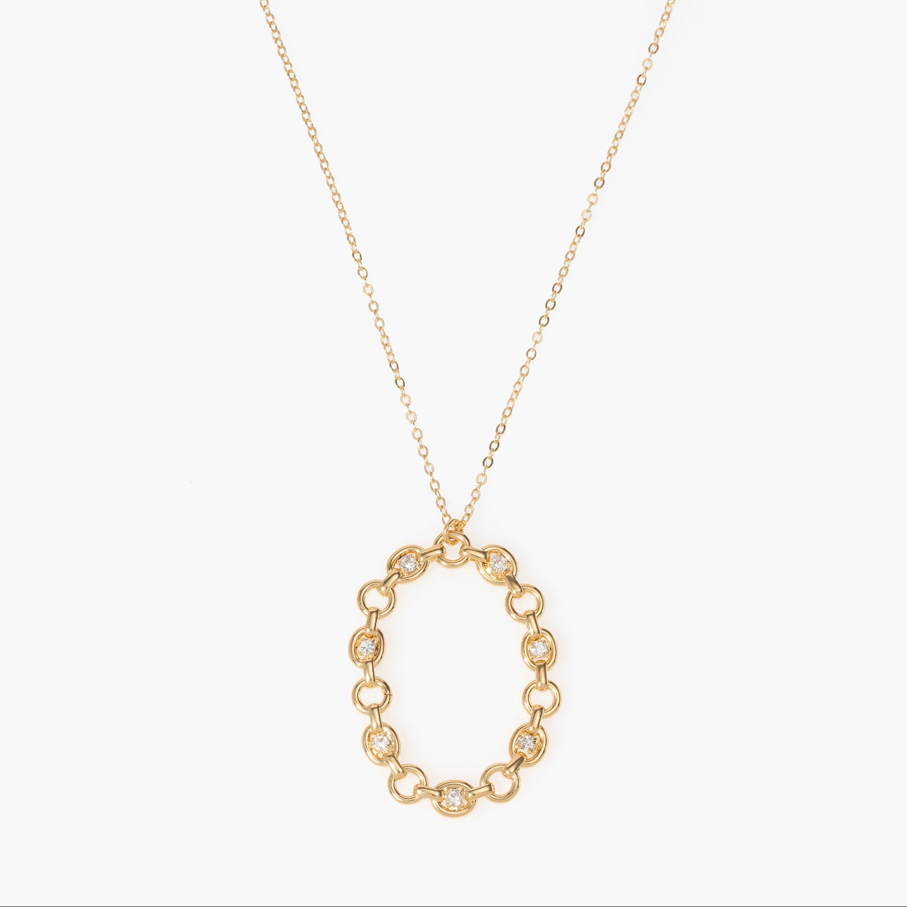 Gold chain necklace with a circular pendant on a white background