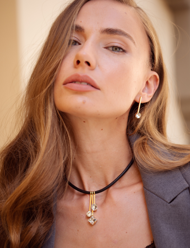 photo of a woman wearinga Three's a Charm Necklace