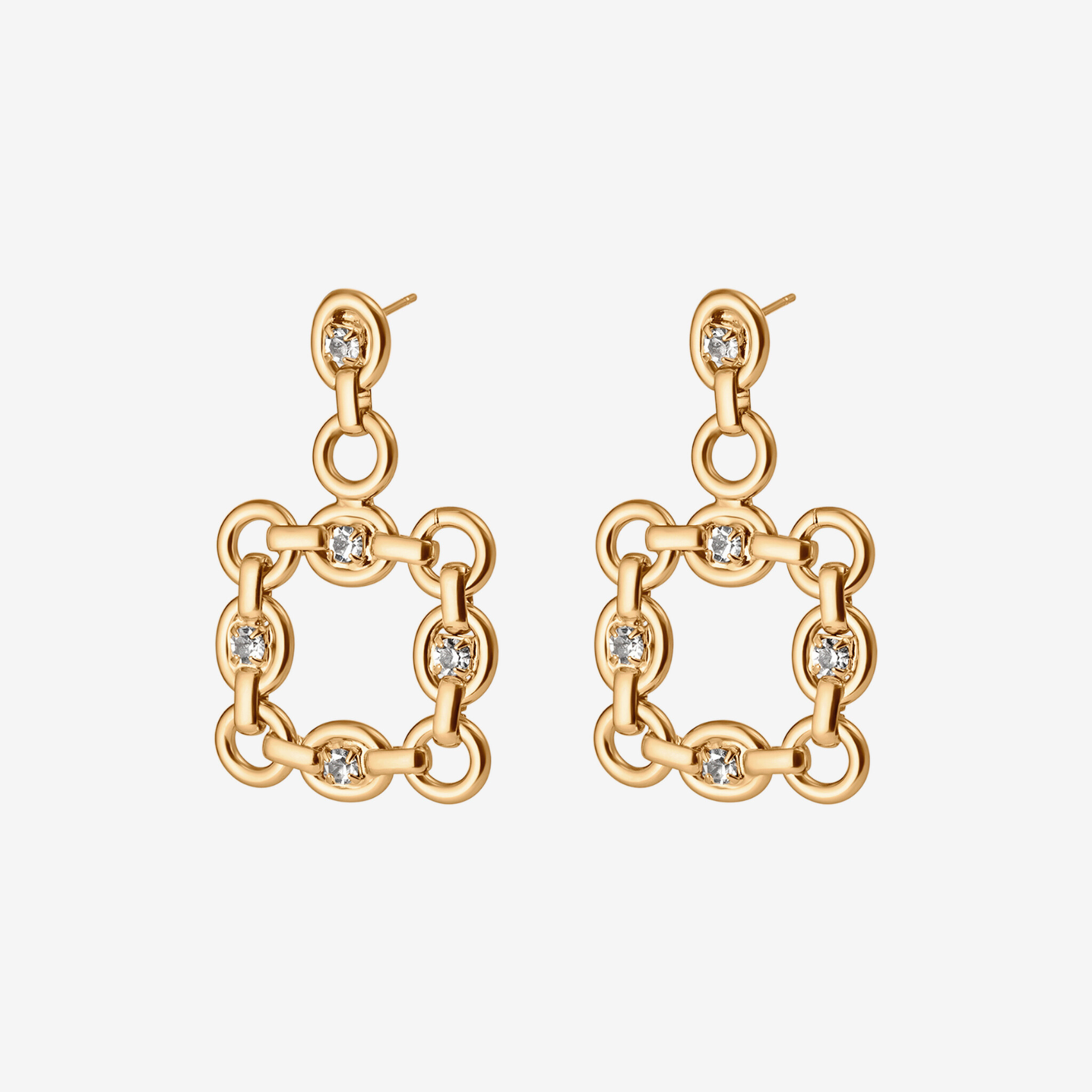 Gold chain-link earrings with diamond-like stones on a light gray background