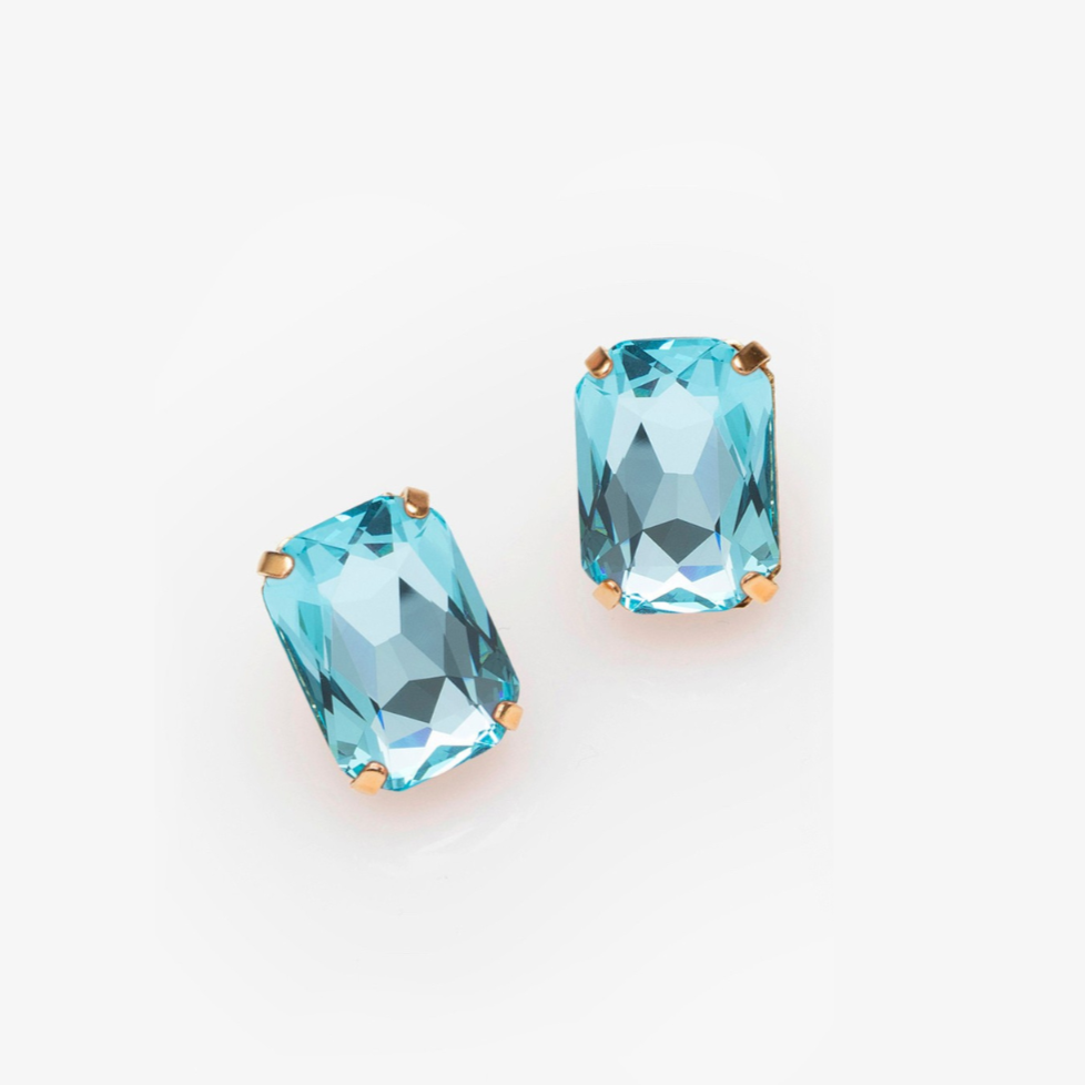 Pair of blue gemstone earrings on a white background