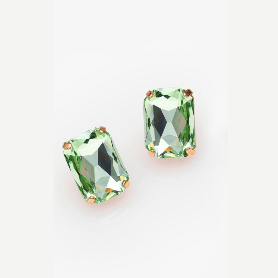 Pair of green gemstone earrings on a white background