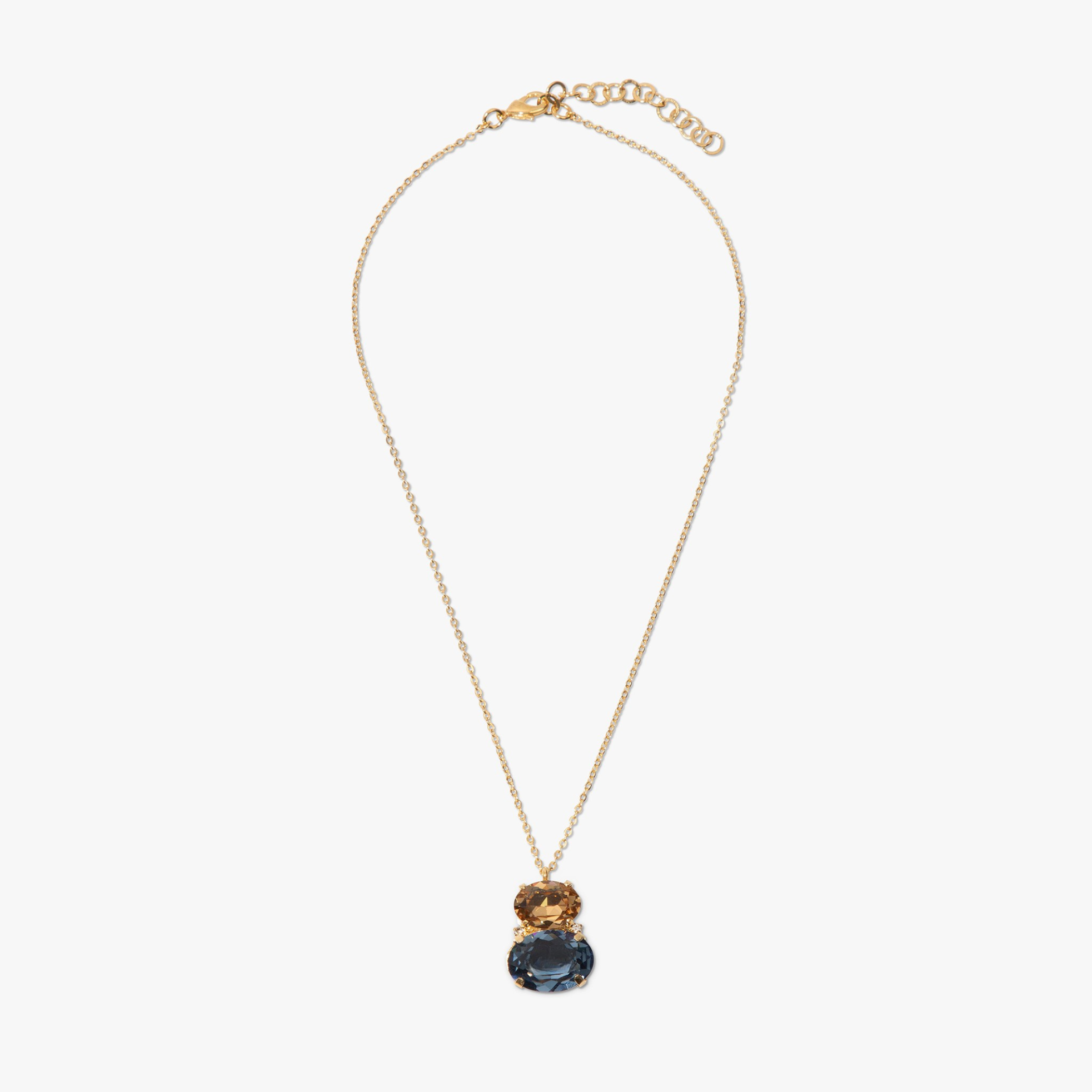 Gold necklace with a dark blue pendant on a white background