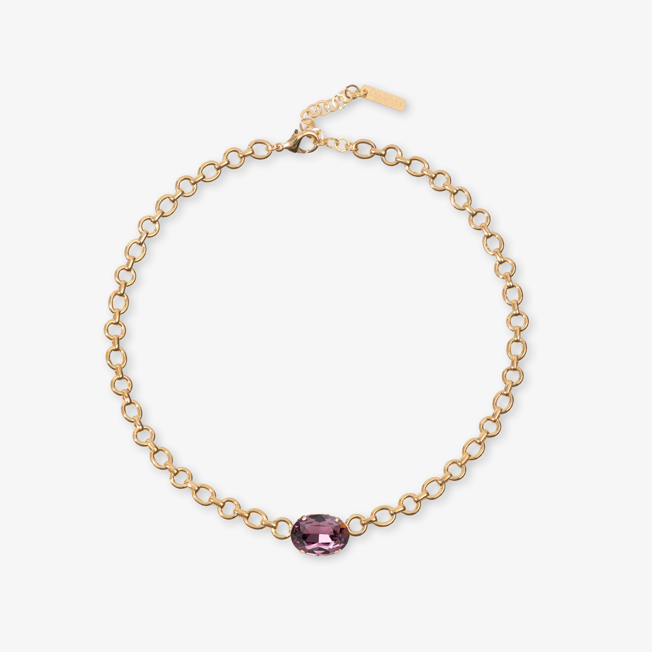 Gold bracelet with a pink gemstone on a white background