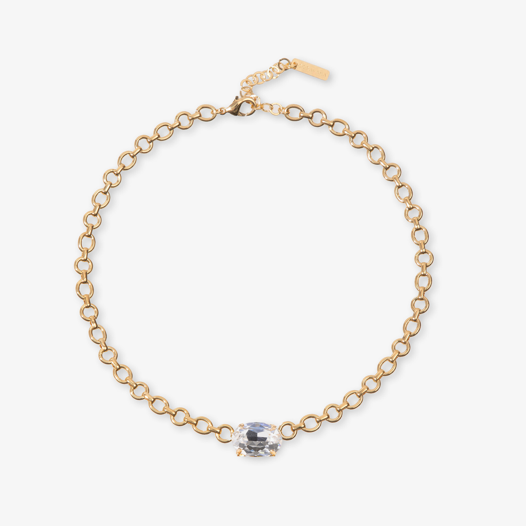 Gold bracelet with a clear gemstone on a white background
