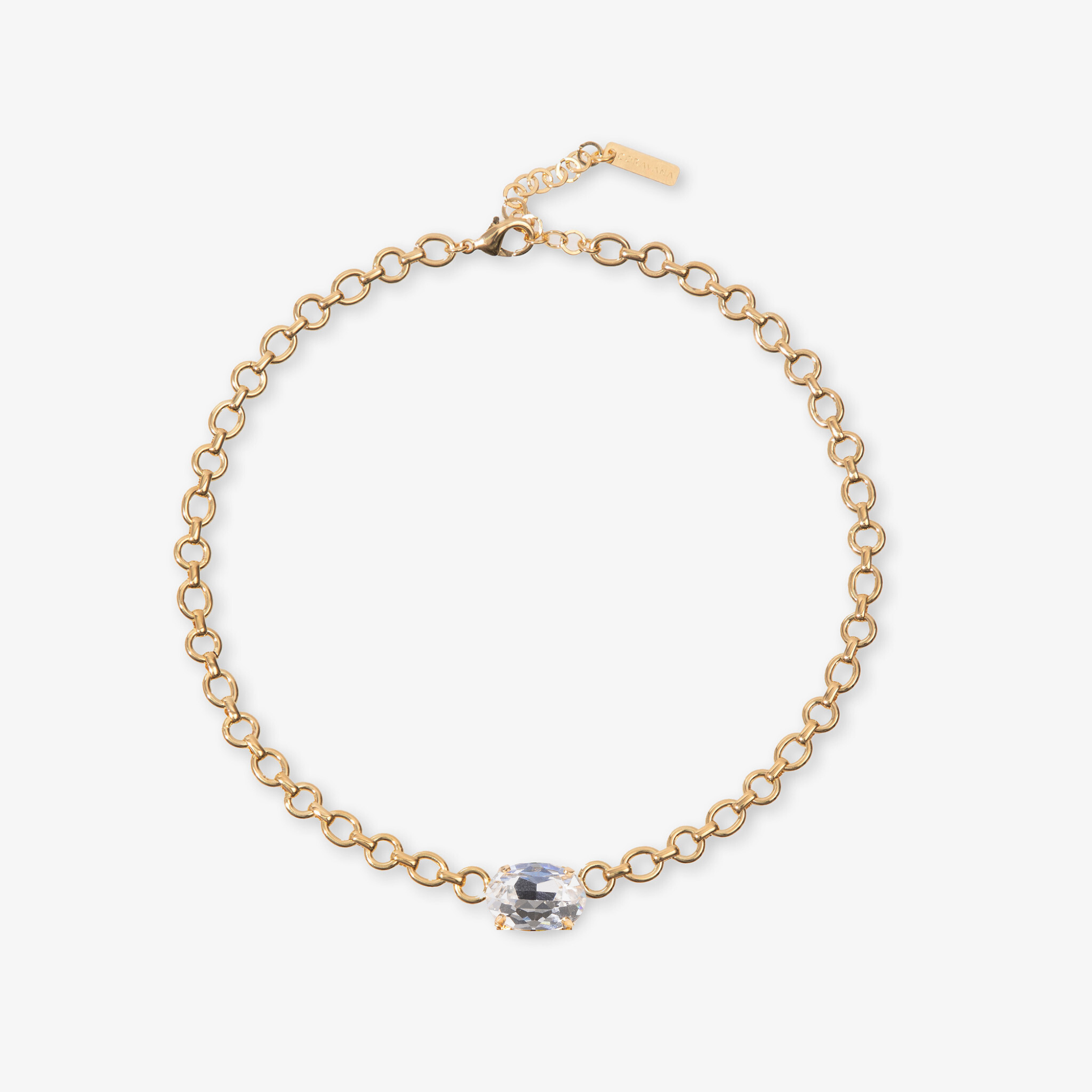 Gold bracelet with a clear gemstone on a white background