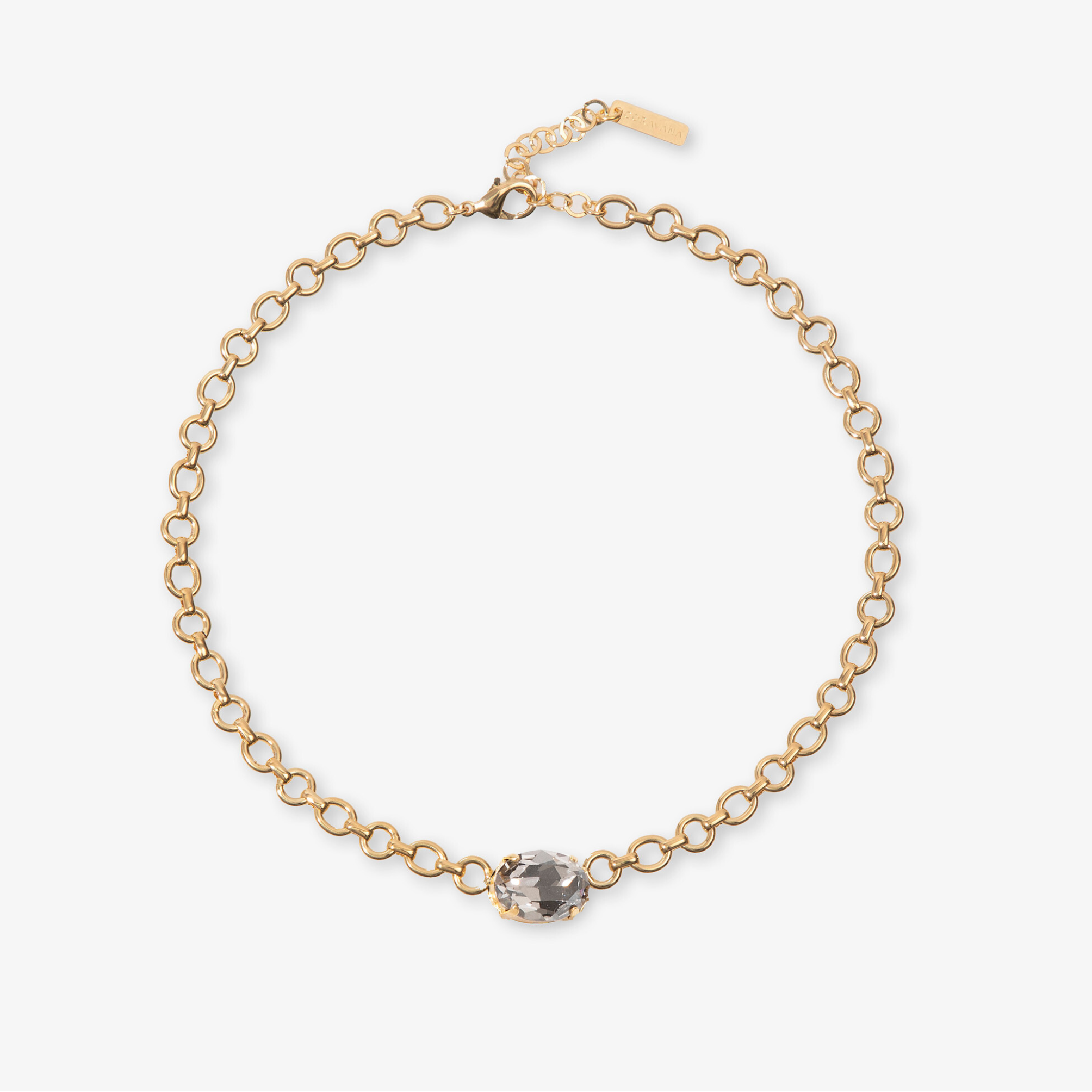 Gold chain bracelet with a dark bead on a white background
