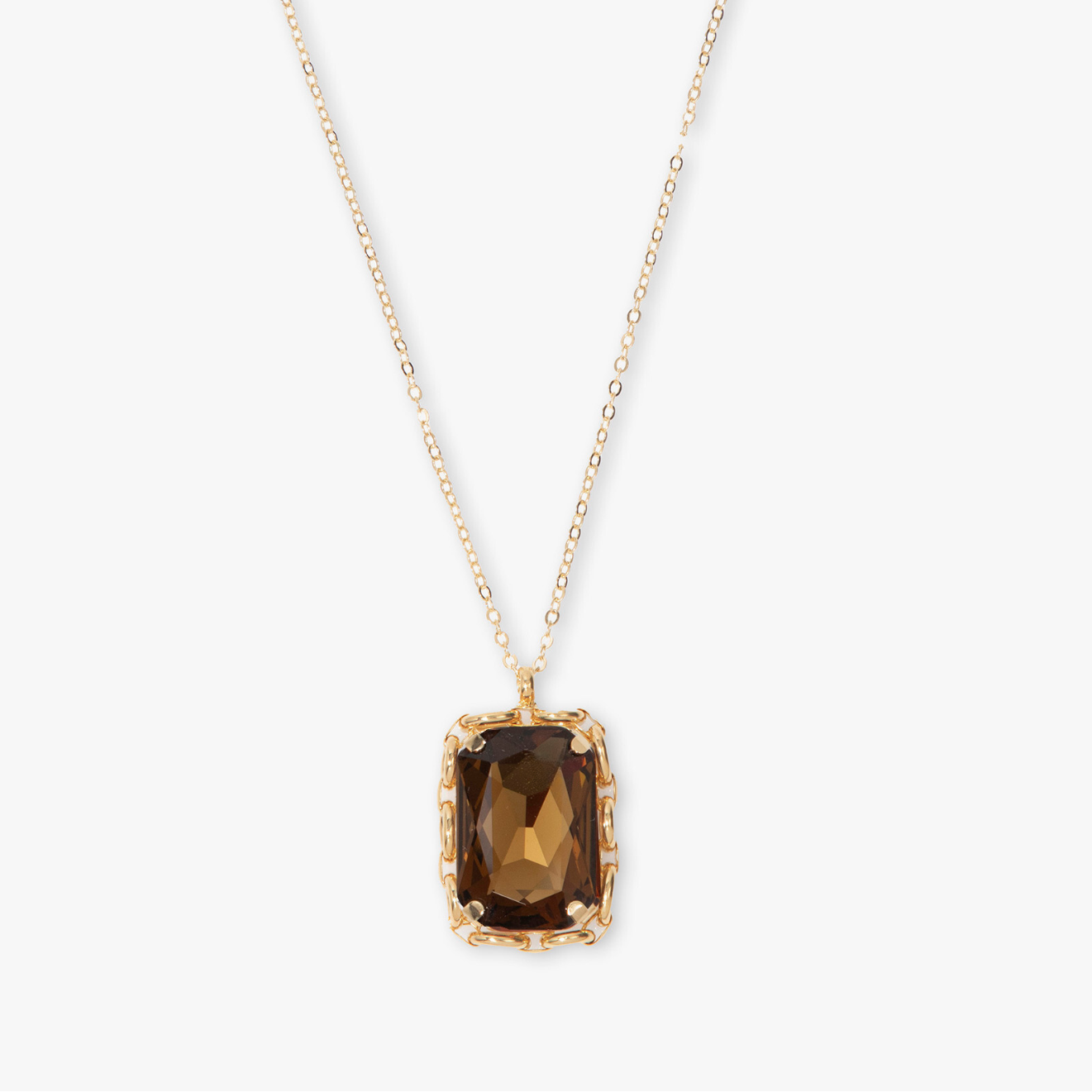 Gold necklace with a smoky quartz pendant on a white background