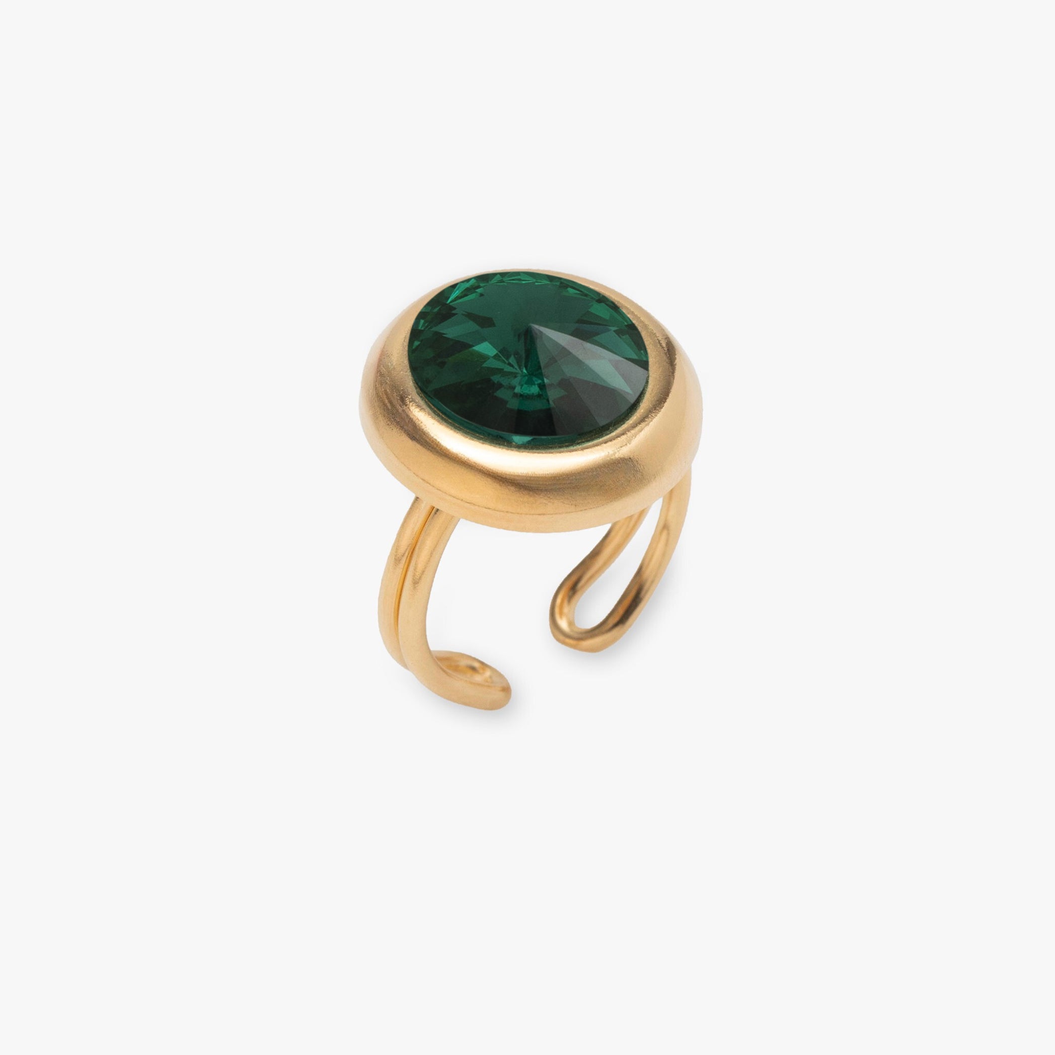 Gold ring with a green gemstone on a white background
