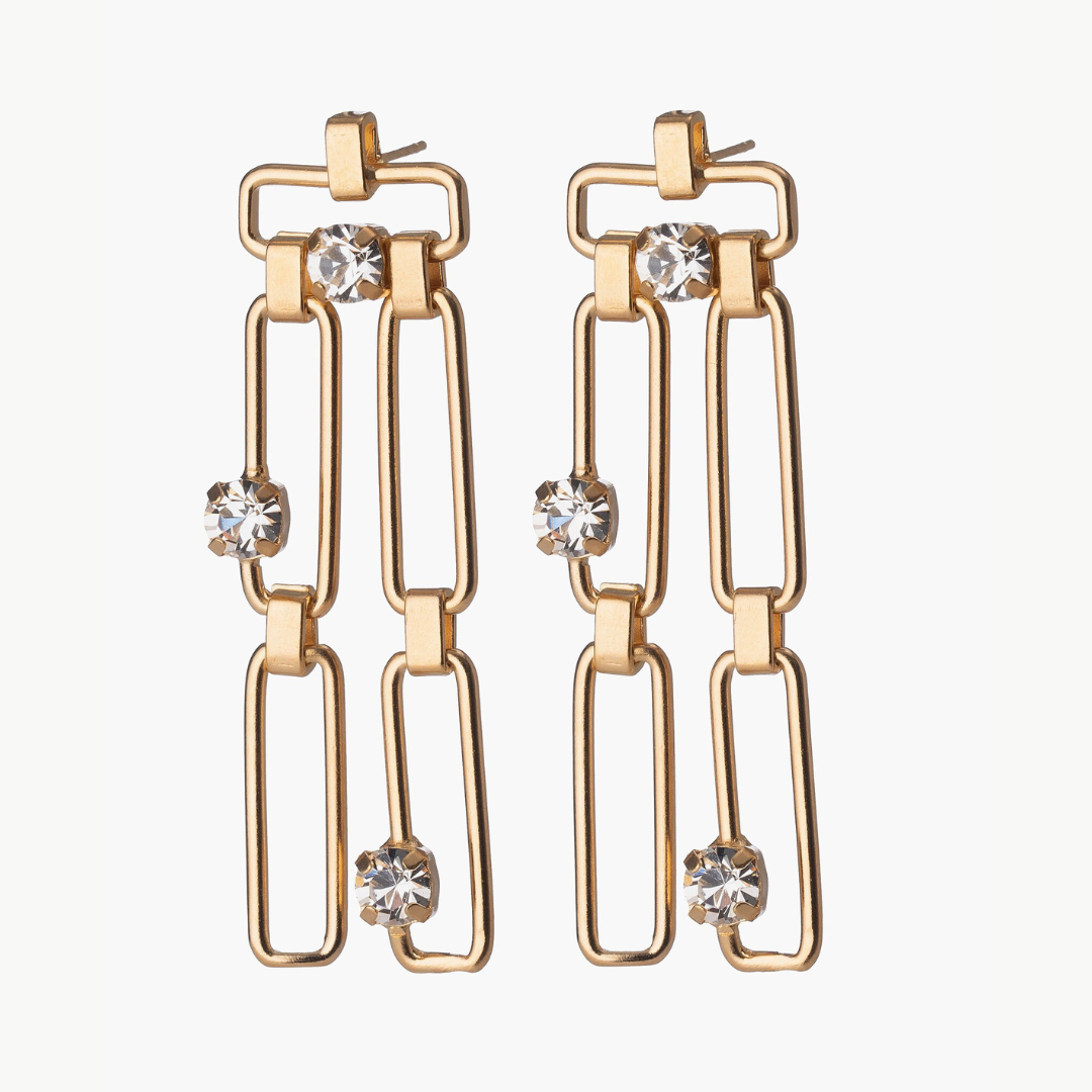 Gold chain-style earrings with crystal-like stones on a white background