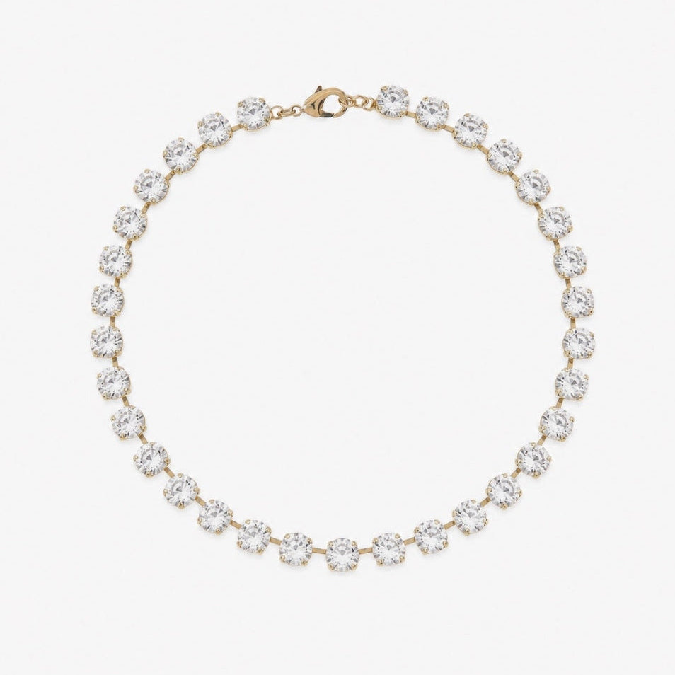 A yellow gold tennis necklace featuring round-cut clear gemstones in a prong setting, arranged in a circular shape on a clean white background.