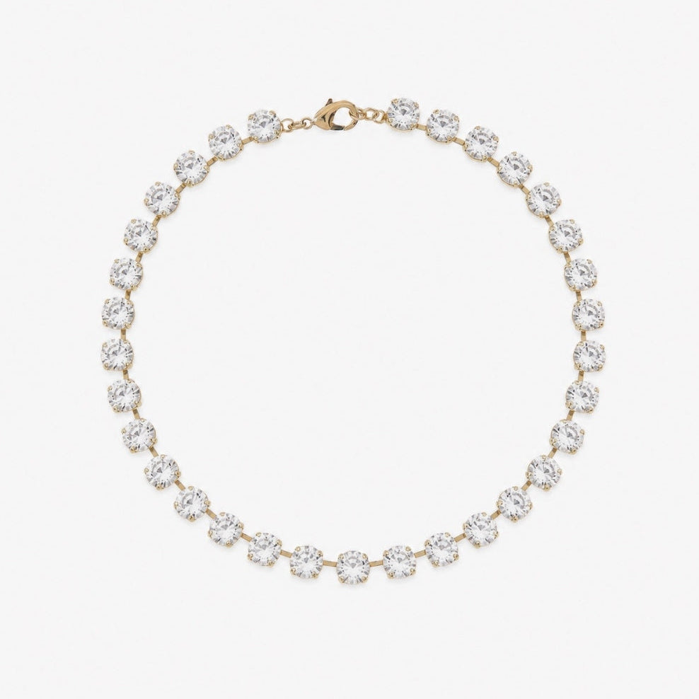 A yellow gold tennis necklace featuring round-cut clear gemstones in a prong setting, arranged in a circular shape on a clean white background.
