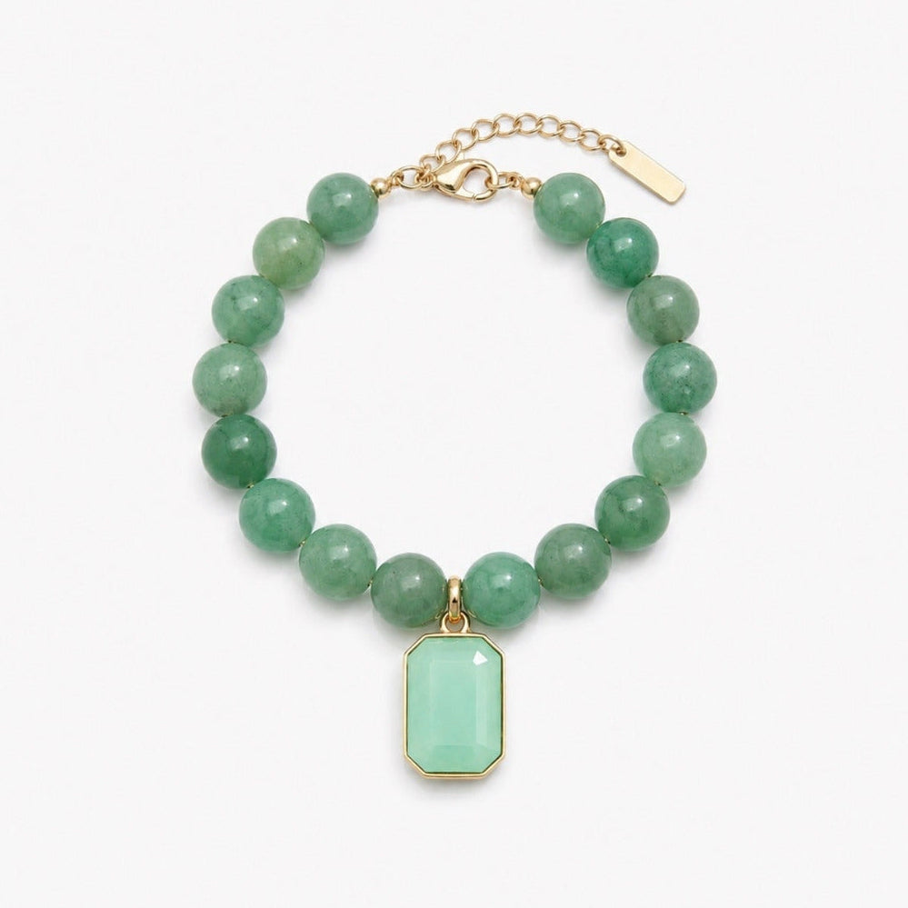A green beaded bracelet with a rectangular mint green pendant and gold-tone chain clasp, shown on a plain white background.