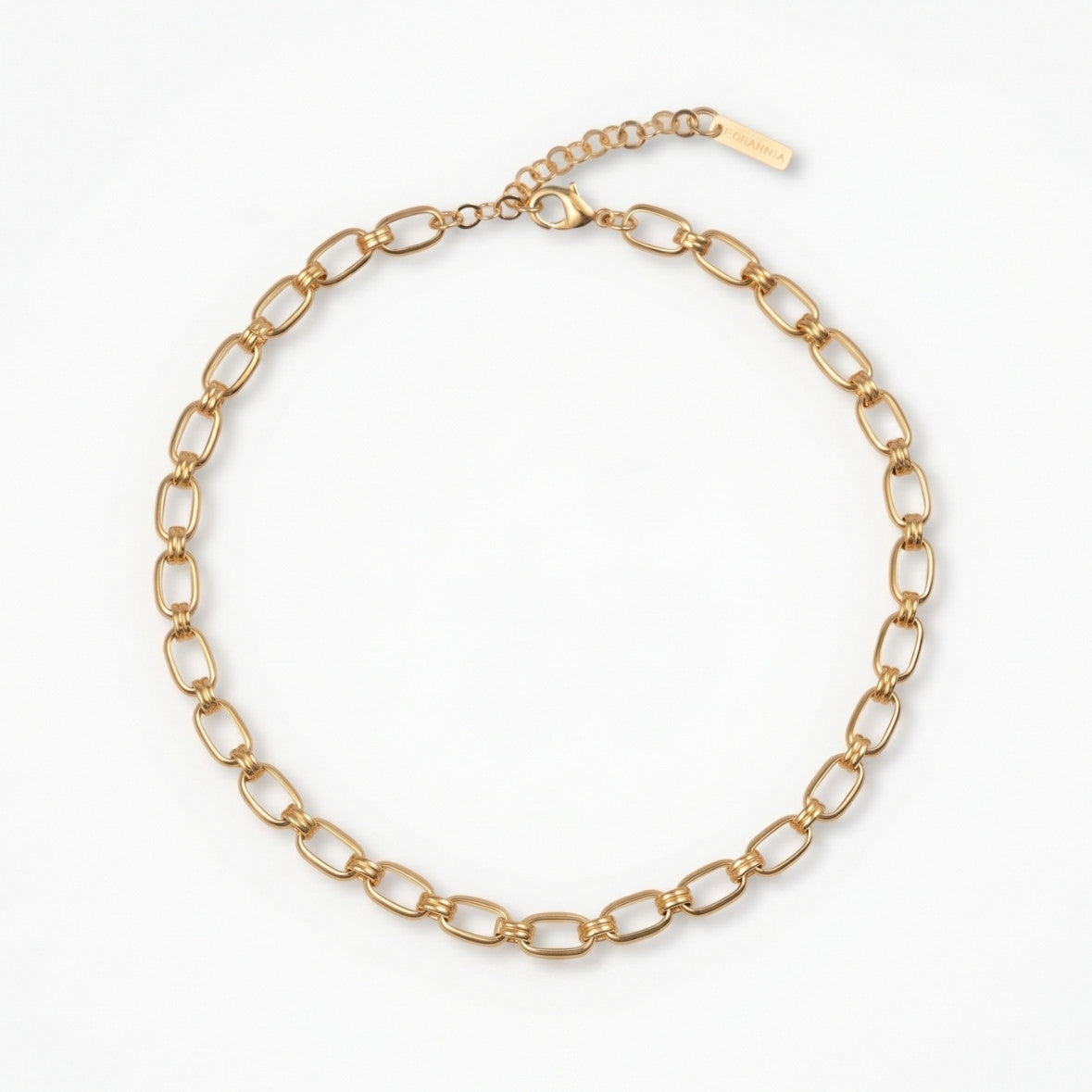 Gold chain necklace on a white background