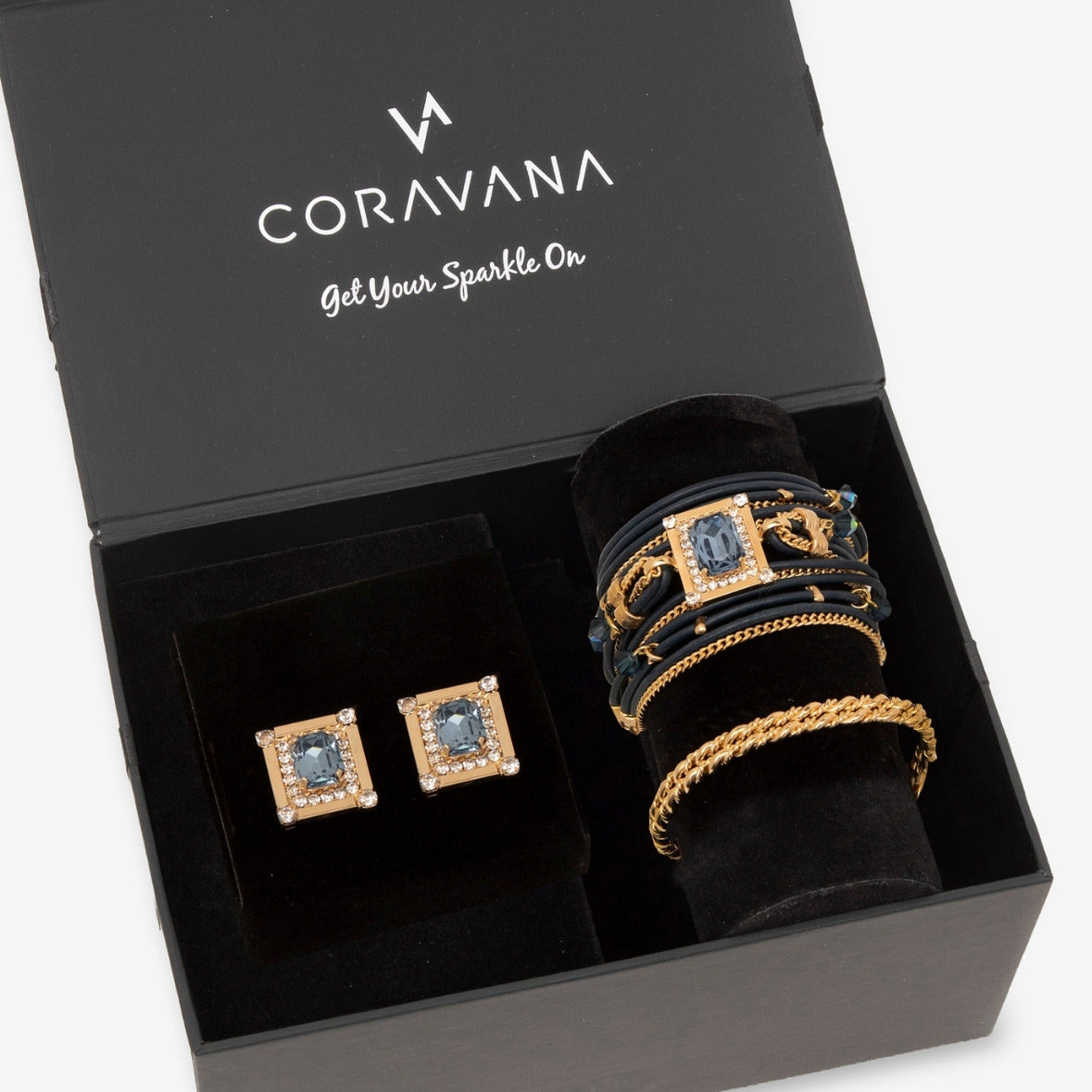 Jewelry set including earrings and bracelets in a Coravana box.