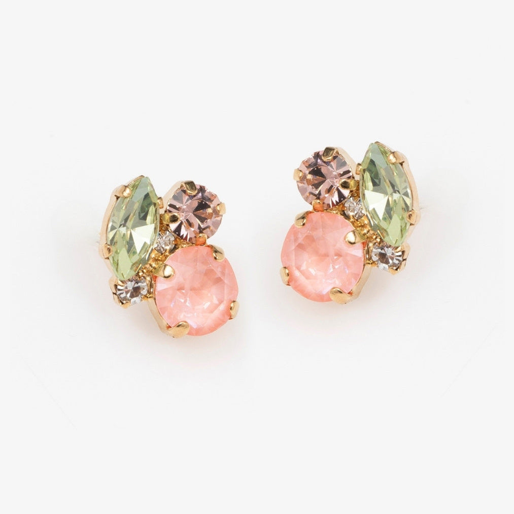 Pair of earrings with pink and green gemstones on a white background