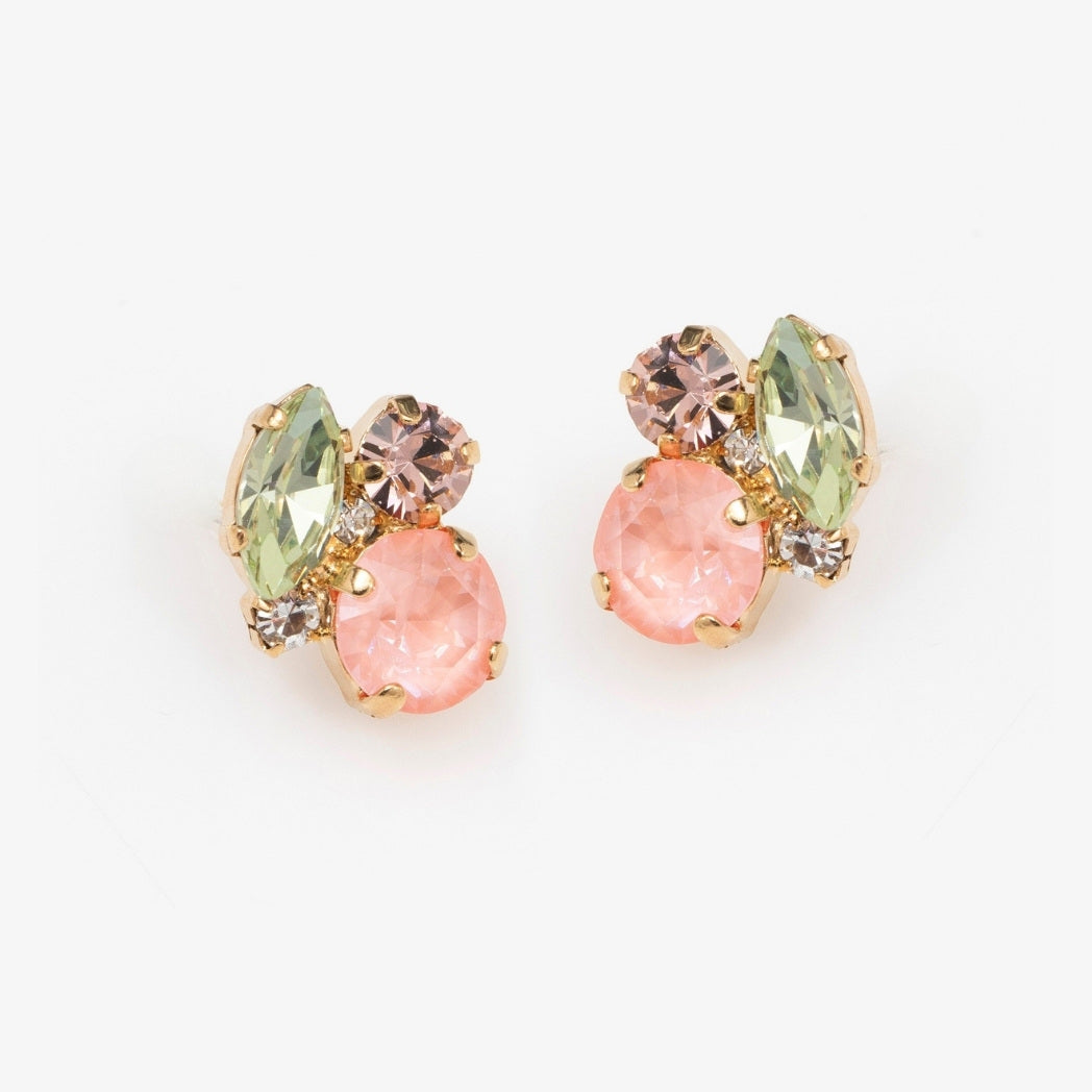 Pair of earrings with pink and green gemstones on a white background