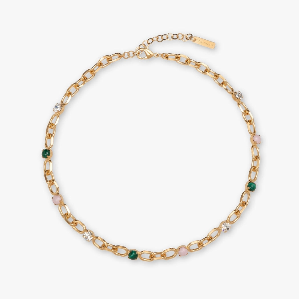 Gold chain necklace with embedded beads on a white background