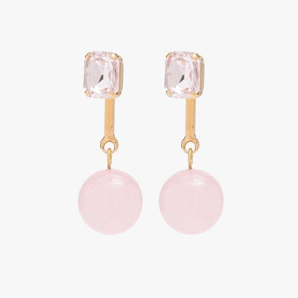 Pair of earrings with pink gemstones and gold accents on a white background