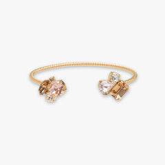 Gold ring with gemstones on a white background