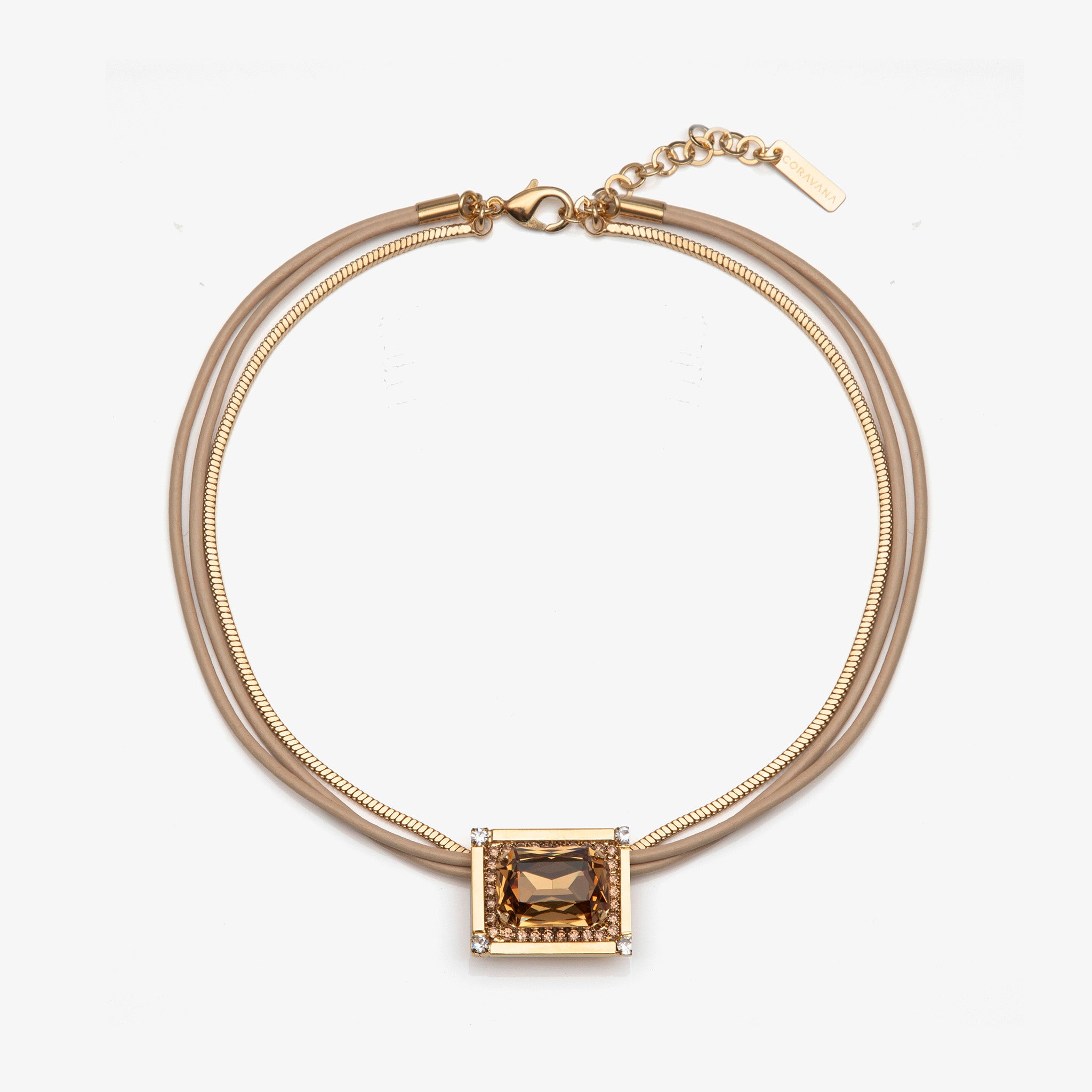 Gold necklace with a square pendant on a white background