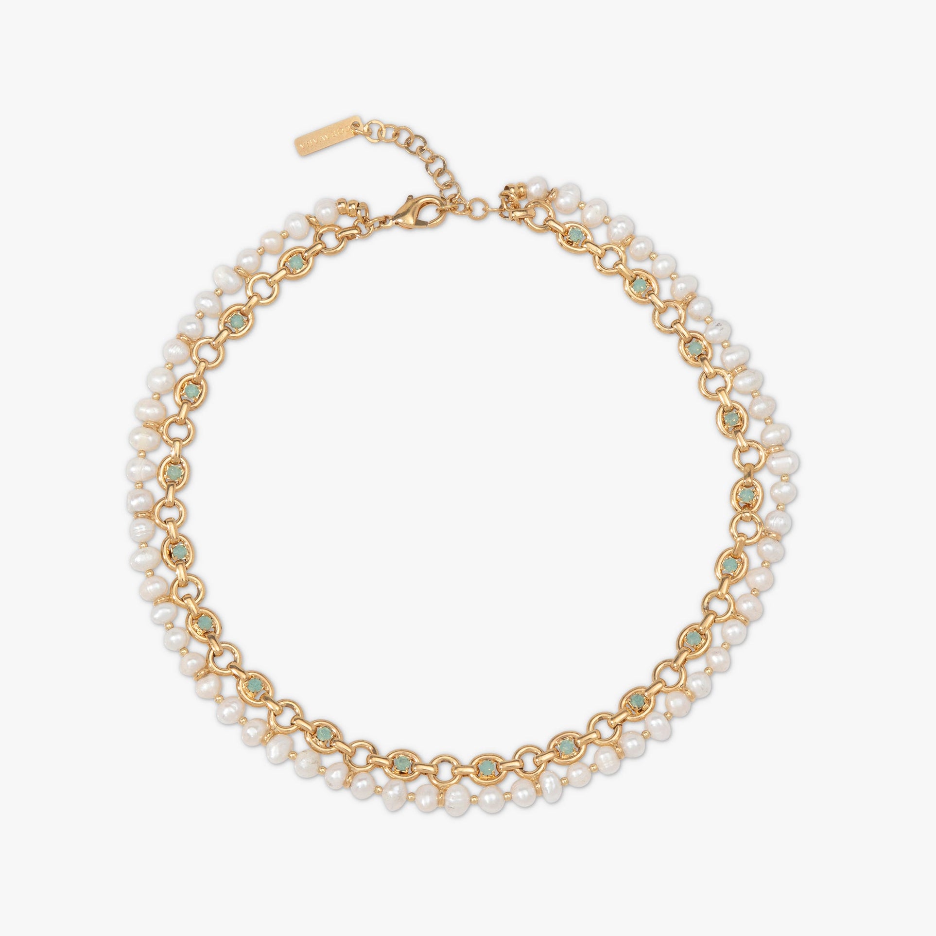 Gold chain necklace with pearl-like beads on a white background