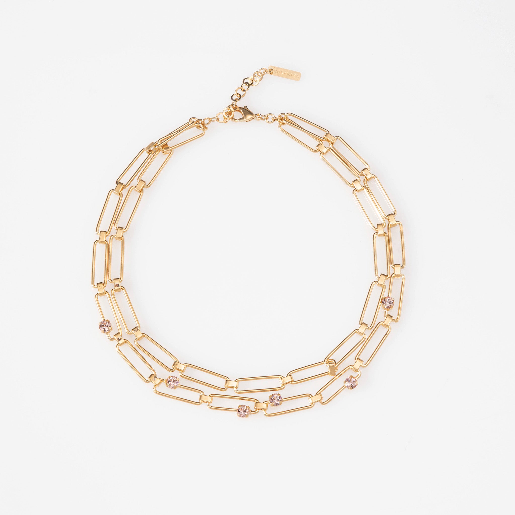 Gold chain necklace on a white background