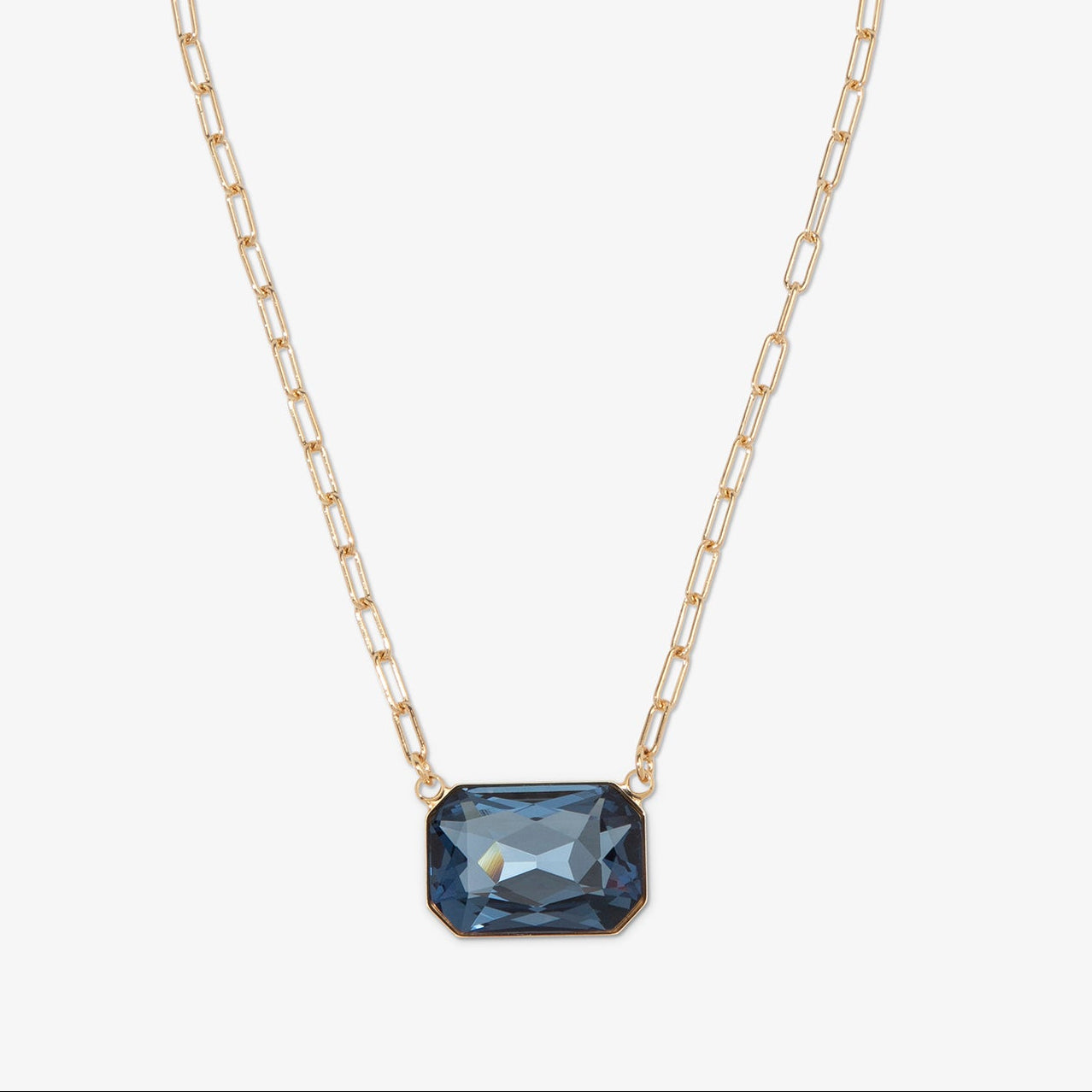 Necklace with a blue gemstone pendant on a white background
