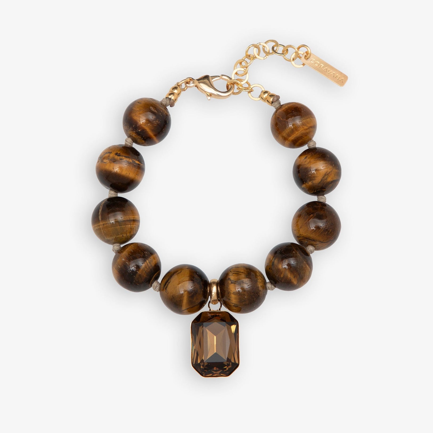 Bracelet with tiger eye beads and a gold chain on a white background