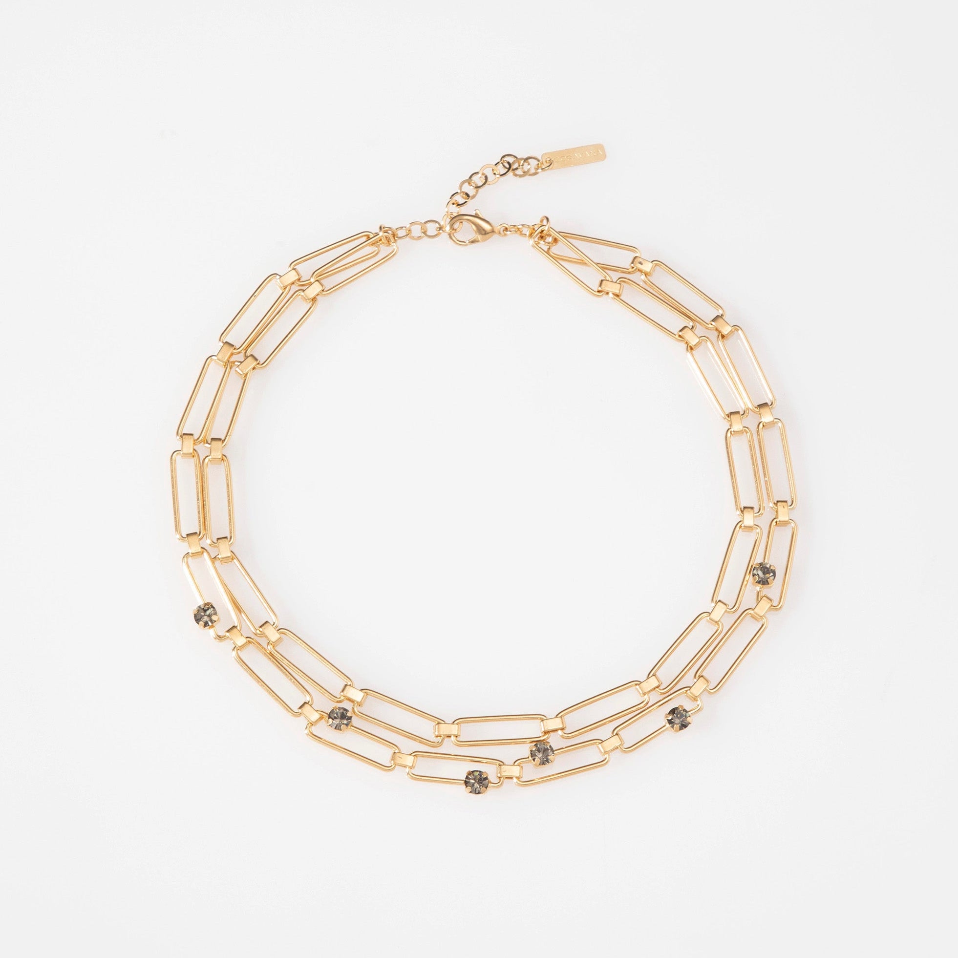 Gold chain necklace on a white background