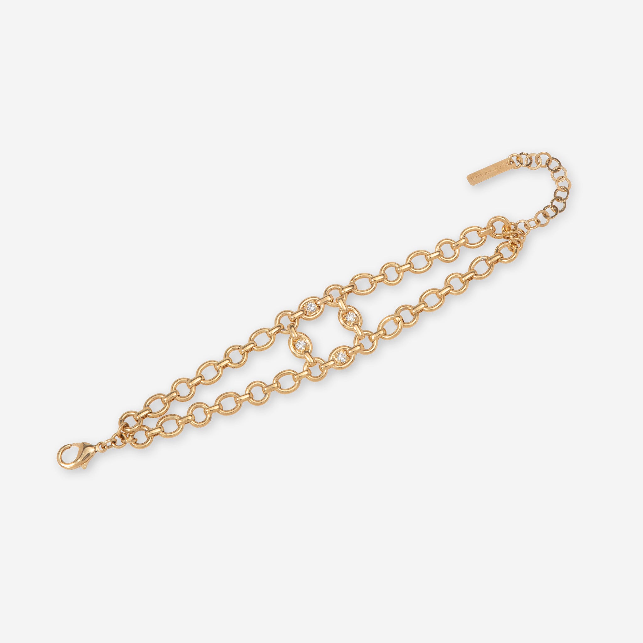 Gold chain bracelet with crystals on a white background