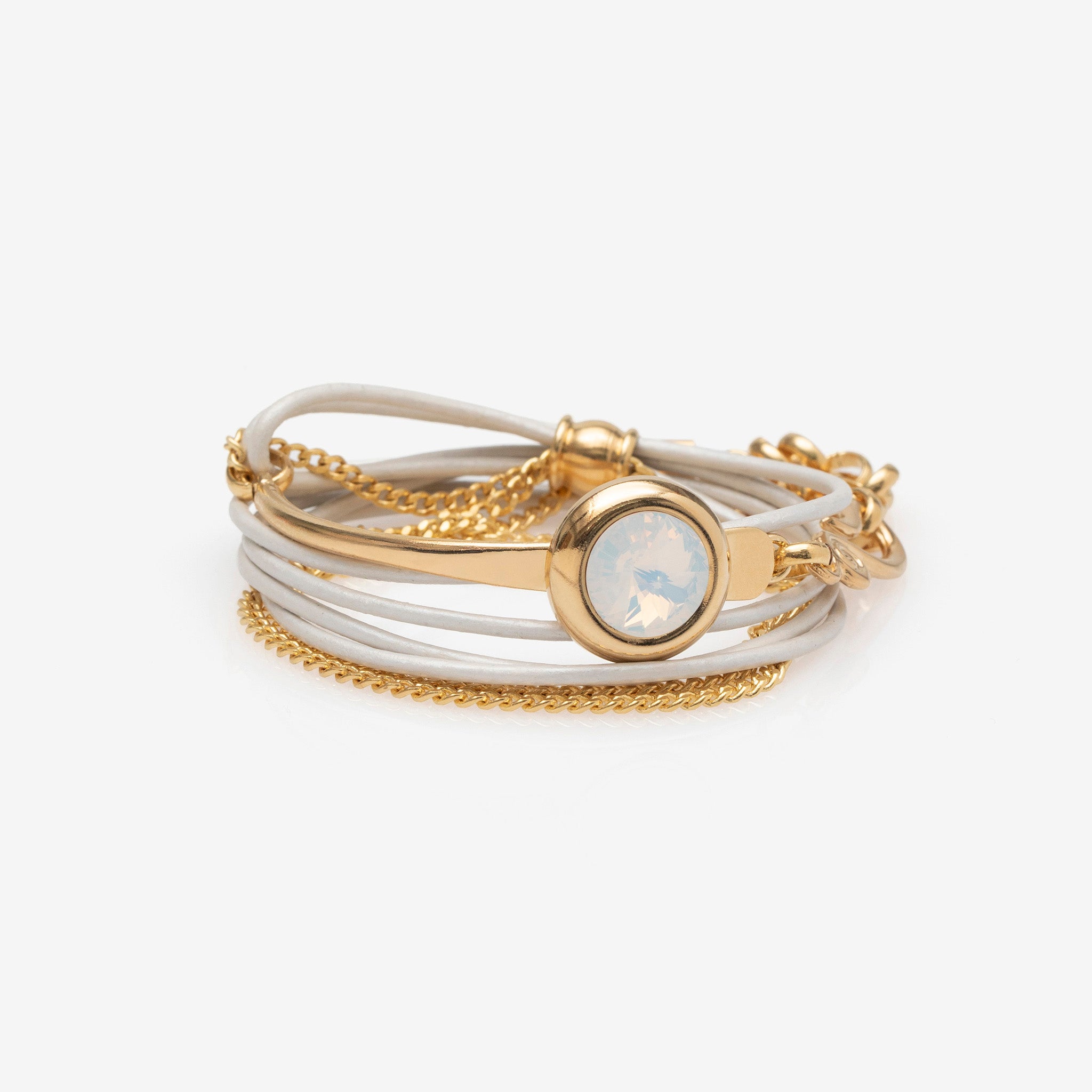 Multi-layered bracelet with gold and white bands on a white background