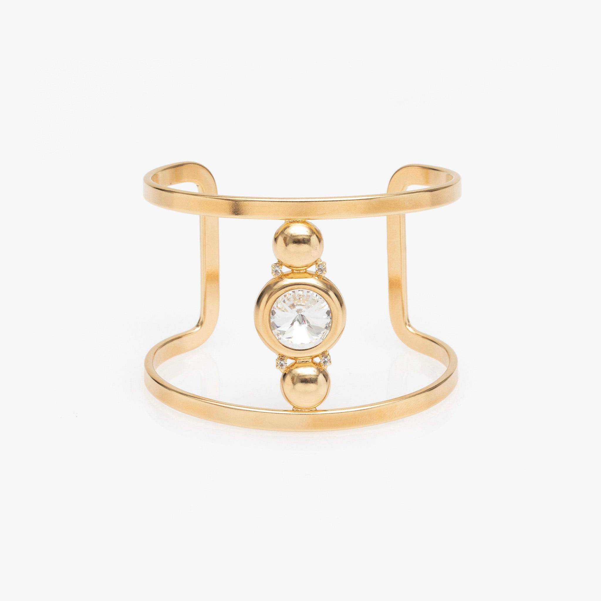 Gold bracelet with a central gemstone on a white background