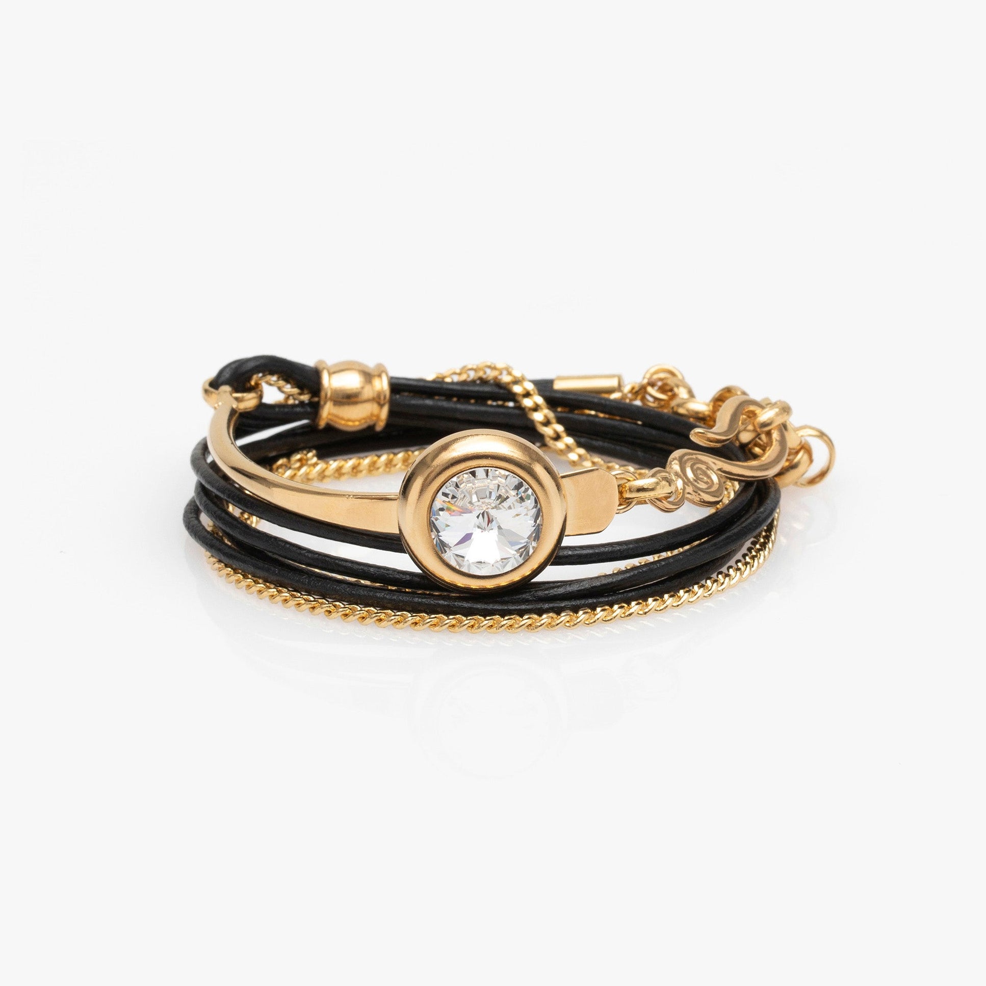 Gold and black bracelet with a central gemstone on a white background