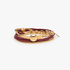 Gold and brown bracelet on a white background