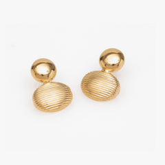 Pair of gold earrings on a white background