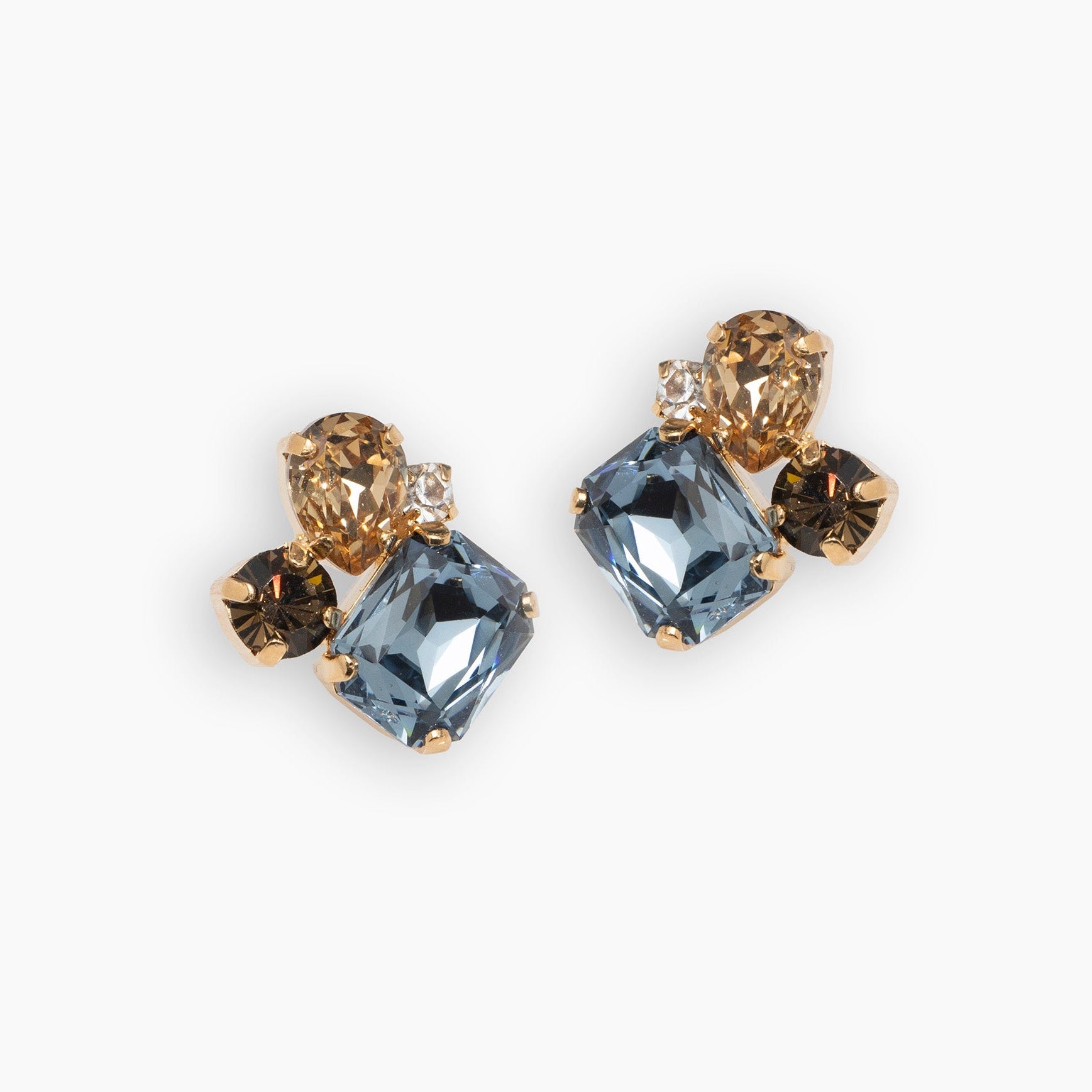 Pair of earrings with blue and brown gemstones on a white background
