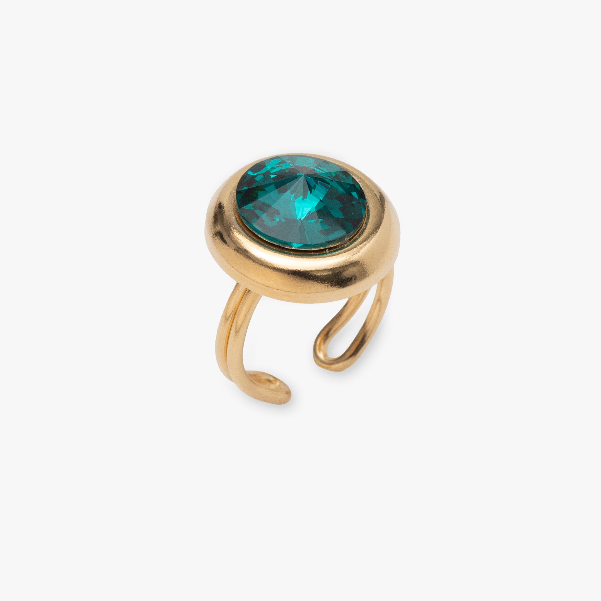 Gold ring with a green gemstone on a white background