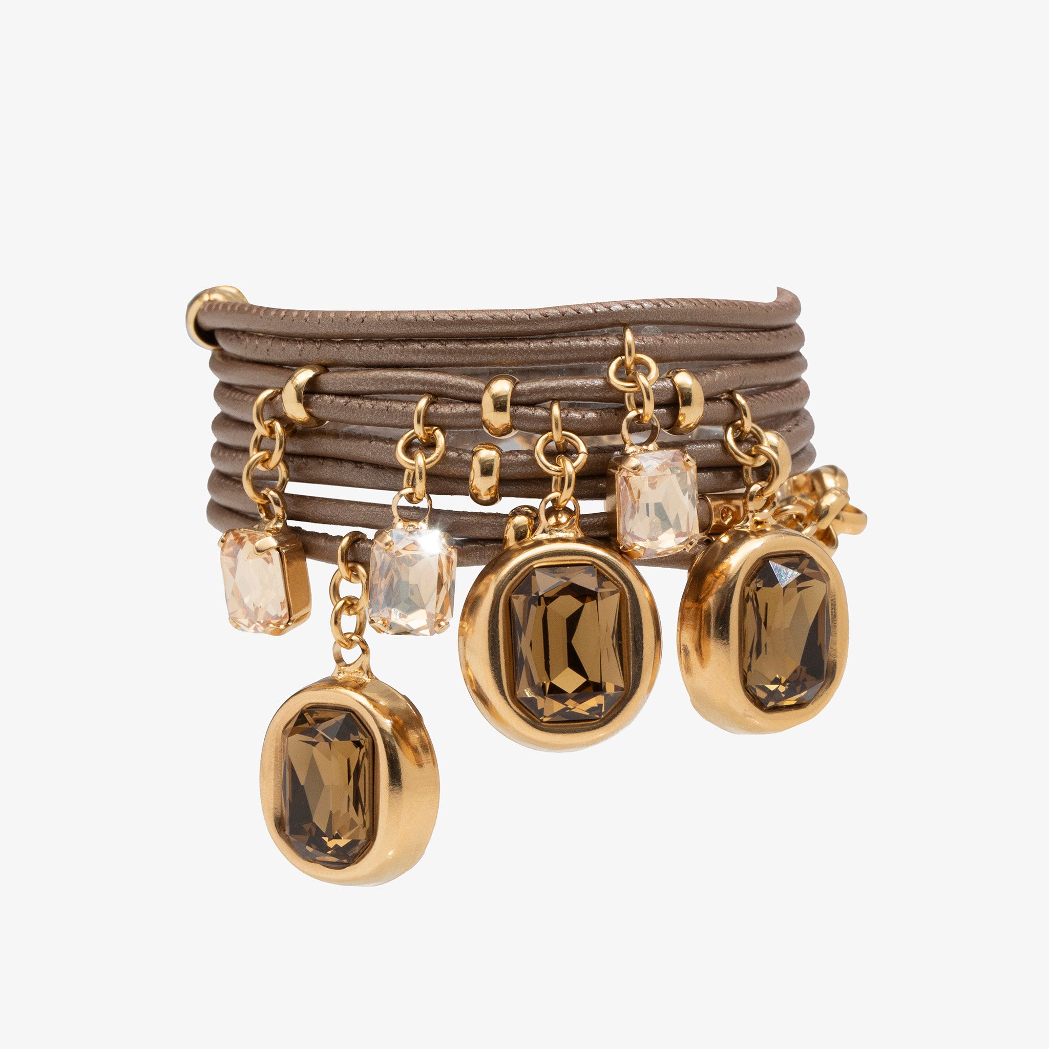Set of gold and brown beaded bracelets on a white background