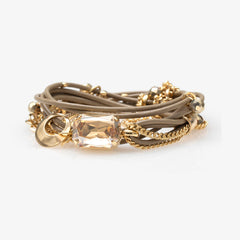 A Mini Stardust Bracelet with a crystal centerpiece, decorated with small crystal beads, and featuring a gold-colored easy-hook closure.