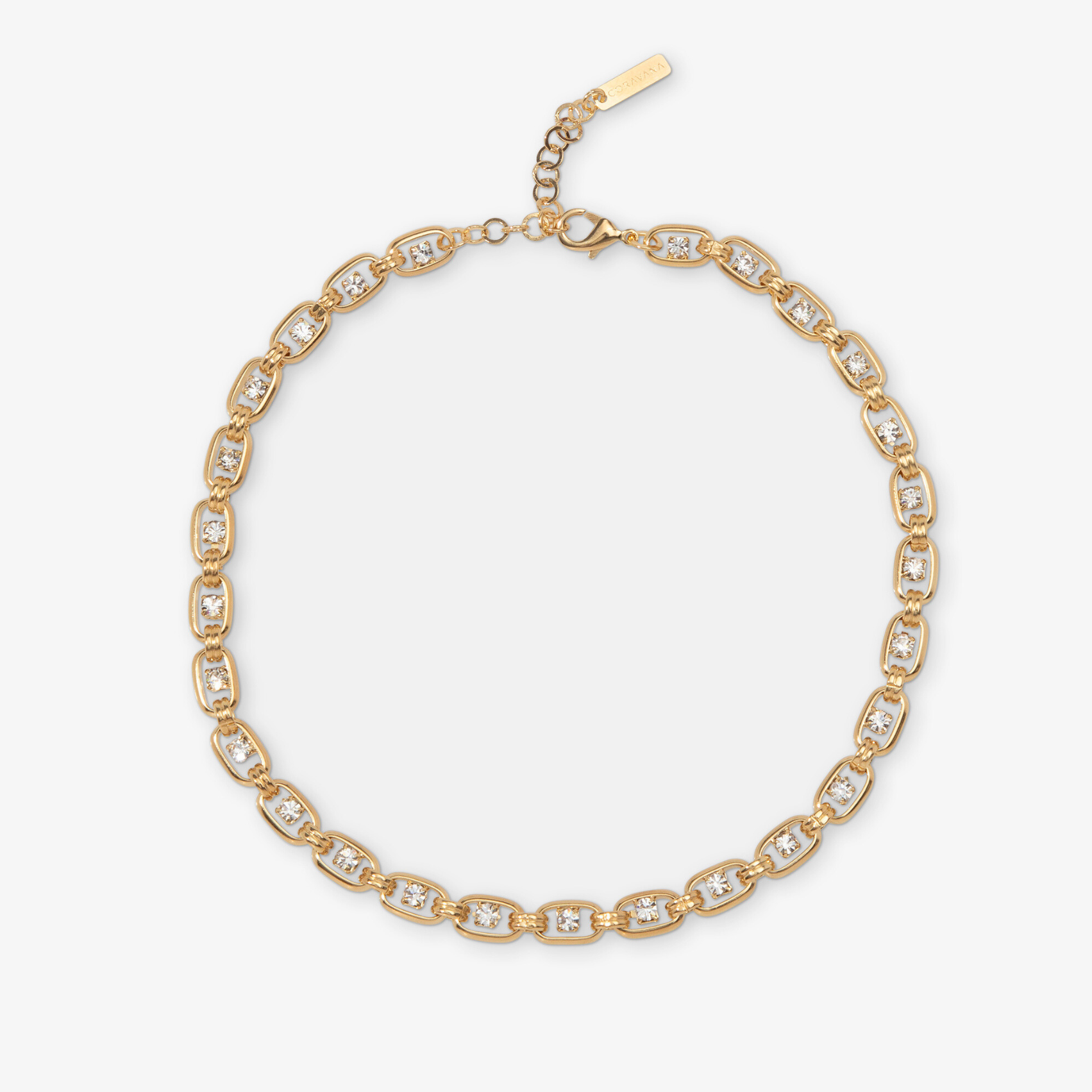 Gold bracelet with clear stones on a white background